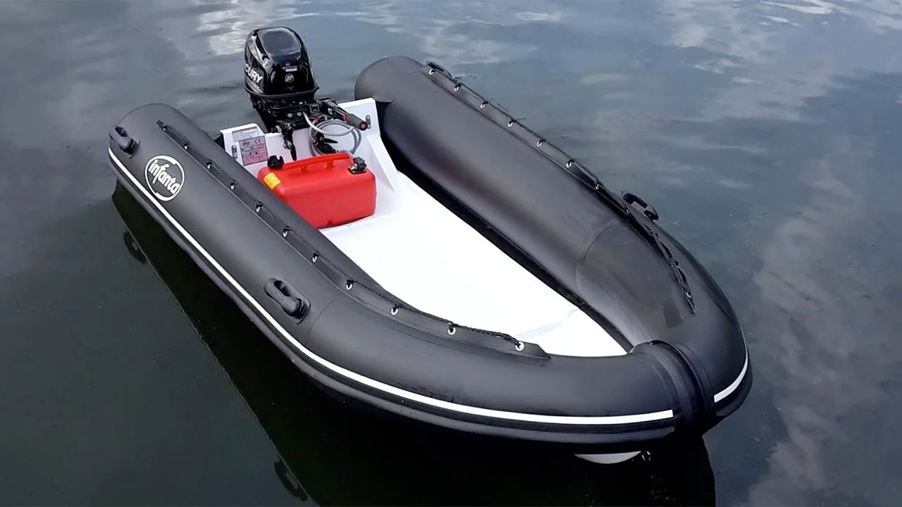 Black inflatable boat lying stationery on dark water